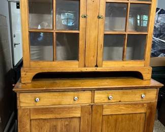 An amazing 2 piece cabinet, lower piece is a buffet, top piece glass doors with shelves - abundance of storage space - beautiful Butternut wood