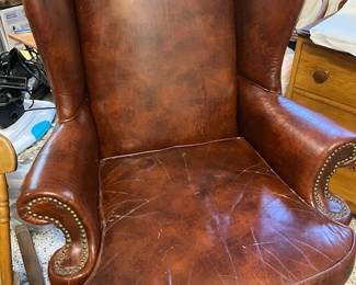 Brown leather wing chair, H 43", W22", D 22"
