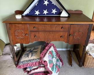 Antique table and hand sewn pillows that turn into a blanket