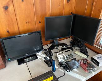 Small tv and 2 monitors.