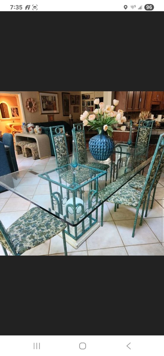 100x41 glasstop table w metal base and 8 metal chairs.
Flower arrangement NOT AVAILABLE