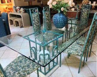 100x41 glasstop table w metal base and 8 metal chairs.
Flower arrangement NOT AVAILABLE