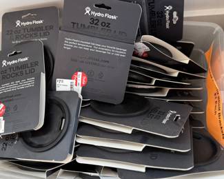 This lot features a massive collection of Hydro Flask accessories – lids, straws, and more.