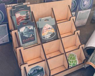 This lot features a collection of displays for maps & stickers, retail signage, maps, and more.
