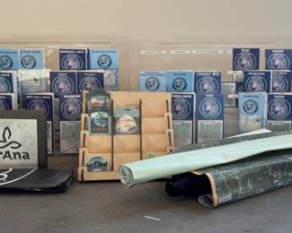 This lot features a collection of displays for maps & stickers, retail signage, maps, and more.