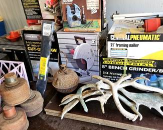 Grinders, chop saw, drill bit sharpener and other new in box tools.