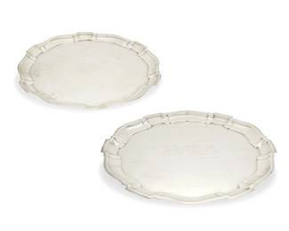 382
A pair of Poole sterling silver 'Chippendale' graduated trays
Early/mid-20th century
Each marked for Poole, sterling, and pattern name; alternately numbered 120 / 130
2 pieces
Larger: 15.625" Dia.; Smaller: 13.625" Dia.
Total weight: 79.1 oz. troy approximately
Estimate: $1,000 - $1,500
