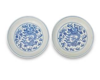 88
A pair of Chinese blue and white porcelain dragon dishes
Daoguang Period (1820-1850)
Each bearing a period reign mark in blue underglaze
The footed dishes each depicting dragons and flaming pearls
2 pieces
Each: 1.375" H x 6.625" Dia.
Estimate: $5,000 - $7,000