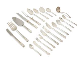 377
An International sterling silver 'Orchid' flatware service
Late 20th century
Each marked: International Sterling
Comprising 12 dinner knives (8.625"), 11 butter spreaders (5.75"), 12 dinner forks (7.25"), 12 viande forks (7.625"), 20 salad forks (6.375"), 12 cocktail forks (5.5"), 12 cream soup spoons (6"), 12 oval soup spoons (7.25"), 21 teaspoons (6"), 12 demitasse spoons (4.125"), 4 table/serving spoons (8.5"), 2 sugar spoons (5.875"), 1 serving fork (9"), 1 pie server (10"), 1 gravy ladle (6.375"), 1 bon bon spoon (4.875"), 1 pickle fork (5.875"), 1 cucumber server (6.25"), 1 jelly server (6.375"), 1 relish spoon (6.125"), and a carving set (knife: 10.25")
152 pieces
Total weighable sterling: 148.6 oz. troy approximately
Estimate: $3,000 - $5,000