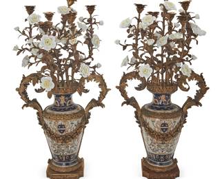 31
A pair of Napoleon III-style bronze-mounted porcelain candelabra
Late 20th century
Each marked in blue underglaze: JM / Italian Design
Each porcelain urn with bronze garlands, opposed foliate-form handles, and architectural base, issuing bronze foliate-form branches terminating in porcelain flowers and seven lights
2 pieces
Each: 33" H x 16.5" W x 14" D
Estimate: $500 - $700