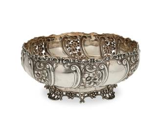 376
A Howard & Co. sterling silver center bowl
1892
Dated and marked to underside: Howard & Co. / Sterling / New York
The round bowl with pierced and repoussé floral motifs, raised on a pierced base
5.25" H x 12.75" Dia.
42.9 oz. troy approximately
Estimate: $1,000 - $1,500