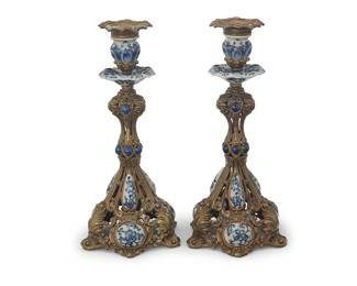 148
A pair of Baroque-style porcelain-mounted brass candlesticks
20th century
Each cast with openwork foliate motifs and mounted with blue and white porcelain accents
2 pieces
Each: 12.75" H x 6.25" Dia.
Estimate: $700 - $900