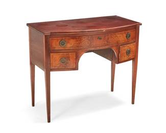 347
A George III mahogany small bow-front sideboard
19th century
With upper locking drawer above opposed smaller drawers, each with brass hardware, raised on tapered legs
28.5" H x 34" W x 18.25" D
Estimate: $500 - $700