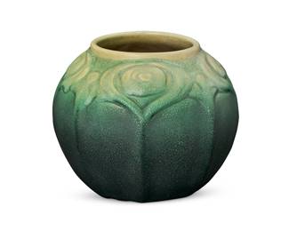 50
A Van Briggle pottery vase
Circa 1905; Colorado Springs, CO
Designed by Artus Van Briggle (1869-1904)
With incised mark for Van Briggle, double 'AA' mark, date, and: I; impressed: 231
With a green gradient matte glaze and stylized peacock feathers in low relief
5.625" H x 6.75" Dia.
Estimate: $800 - $1,200