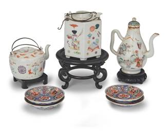 84
A group of East Asian polychrome enameled porcelain tea wares
19th/20th century
Some with various red underglaze marks; saucers with sticker: Made in Japan
The assembled group comprising three Chinese teapots on wood stands, four Japanese saucers, and an associated footed cup painted with figural scenes (not pictured)
8 pieces
Tallest teapot: 6.375" H x 5.5" W x 3.375" D; Each saucer: 3.875" Dia.
Estimate: $800 - $1,200