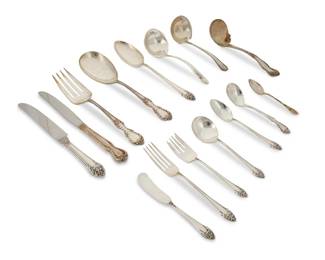 384
A Reed & Barton sterling silver 'Fragrance' flatware service
Mid-20th century
Each marked for Reed & Barton and for sterling
Comprising 12 dinner knives (9"), 12 butter spreaders (6"), 11 dinner forks (7.125"), 12 salad forks (6.125"), 12 cream soup spoons (6"), 12 teaspoons (6"), and 3 serving spoons (8.5"), together with 9 associated sterling and plated utensils from various makers including gravy ladles
83 pieces
Total weighable sterling: 77.9 oz. troy approximately
Estimate: $1,000 - $2,000