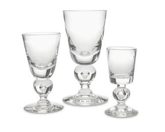 394
A Steuben glass 'Baluster' stemware service
Late 20th century
Each with etched Steuben script mark; Box marked: Steuben Showroom / Bullock's Wilshire
Pattern 7877, comprising 12 caret wine glasses (5.75"), 12 water goblets (6.75"), and 4 cordials (4.375"), together with 2 smaller cordials in pattern 7926 (3.75"), the water goblets housed in a formed Bullock's Wilshire box
30 pieces
Box: 7.875" H x 17.5" W x 13.25" D
Estimate: $700 - $900