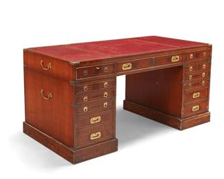 356
An English campaign-style brass-mounted mahogany pedestal desk
Late 19th/early 20th century
With brass pulls, hardware, and opposed handles, the top with inset gilt-stamped red leather surface and apron with three drawers, raised on two six-drawer pedestals
Overall: 30.5" H x 61" W x 32" D; Each cabinet: 24.25" H x 16" W; Top: 6.125" H
Estimate: $1,000 - $1,500