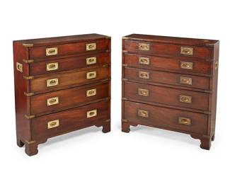 327
A pair of campaign-style brass-mounted dressers
Early 20th century
Each five-drawer dresser raised on bracket feet, with brass pulls, corner accents, and opposed handles, each with a gold-toned finish
2 pieces
Each: 32" H x 28.25" W x 9" D
Estimate: $600 - $800