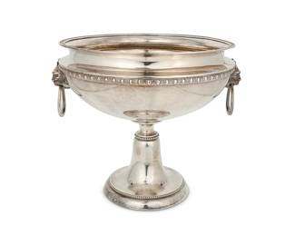 387
A Tiffany & Co. sterling silver pedestal bowl
Mid-19th century; Directorship of John Chandler Moore (1853-1869)
Marked: Tiffany & Co. / M [in a cartouche] / Quality 925-1000 / 1131 / 9632
With opposed grotesques and loop handles
10.5" H x 13" W x 11.75" D
56 oz. troy approximately
Estimate: $1,000 - $1,500
