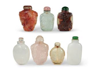 167
A group of Chinese carved stone snuff bottles
19th/20th century
Each depicting foliate motifs or figures in relief, one incised, comprising two agate, one rose quartz, and four others of various stones
7 pieces
Tallest: 3" H
Estimate: $800 - $1,200