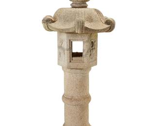 263
A Japanese ikekomi-doro stone garden lantern
20th century
The carved granite garden ornament lantern of six components, comprising a four-window hollow hexagonal fire cavity, above a columnar base and surmounted by an umbrella with scrolled accents
6 pieces
Overall without base: 57" H x 25" W x 22" D
Estimate: $1,000 - $1,500