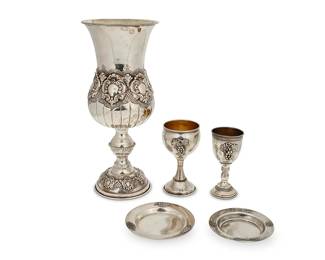 109
A group of sterling silver Kiddush cups
20th century
Two marked for sterling, the rest XRF tested for sterling; large cup marked: Executive
Comprising a large footed cup and two smaller cups with underplates
5 pieces
Largest: 12.125" H x 5.25" Dia.; Shortest: 4.75" H x 2.375" Dia.
Total weight: 32.7 oz. troy approximately
Estimate: $500 - $800