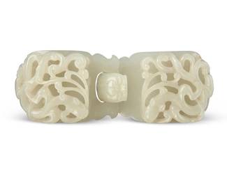 172
A Chinese carved jade dragon two-part belt buckle
18th century or later
Each side with openwork carving of a scrolling chilong, the undersides carved with a button, the hook carved as the head of a mythical beast
Clasped: 1.5" H x 4.75" W x 1" D
Estimate: $2,000 - $4,000