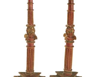 126
A pair of Spanish Colonial carved wood torchères
19th century
The parcel-gilt and red-painted wood candle holder pedestals, each with a gilt tole crown above a columnar standard with foliate motif accents, raised on a tiered triangular base
2 pieces
Each: 59.5" H x 21.75" W x 19" D
Estimate: $800 - $1,200