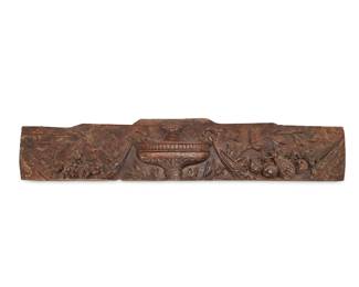 24
A Continental boiserie fragment
18th/19th century
The carved wood panel depicting an urn centering fabric swags cradling fruits in high relief
10.25" H x 58" W x 2.625" D
Estimate: $400 - $600