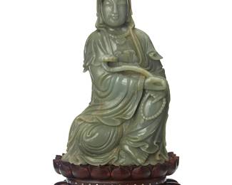 185
A large Chinese carved jade figure of Guanyin
20th century
Depicted with ruyi scepter, set on a carved woof tiered hardwood double-lotus base
Jade: 17.75" H x 10" W x 6" D; Stand: 4.25" H x 12.5" W x 8.25" D
Estimate: $1,000 - $1,500
