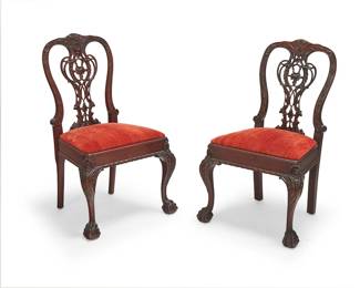 395
A pair of Chippendale-style mahogany side chairs
Late 19th/early 20th century
Each with carved openwork back depicting foliate motifs above a fabric upholstered seat, raised on ball and claw front feet
2 pieces
Each: 38.5" H x 23.75" W x 22.5" D
Estimate: $300 - $400