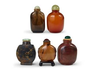 170
Five Chinese carved stone snuff bottles
19th/20th century
Comprising one smoky quartz, one agate, and three other hardstone bottles, one set on a wood stand
5 pieces
Tallest: 3.375" H
Estimate: $600 - $800