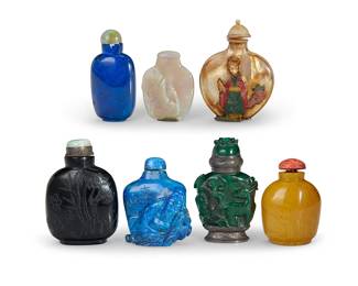 168
A group of Chinese snuff bottles
19th/20th century
Comprising one opal depicting a goldfish, one malachite depicting flora and fauna in relief and mounted with metal, one blue hardstone depicting a scholar figure in relief with incised script, one dark blue hardstone with incised foliate motifs and script verso, two more hardstone, and one mother of pearl-mounted hardstone with hardstone overlay depicting a maiden to each side
7 pieces
Tallest: 3" H
Estimate: $700 - $900
