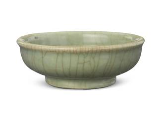 70
A Chinese celadon porcelain bowl
Qing Dynasty (1644-1912) or later
The footed bowl with pale green glaze
2.25" H x 6" Dia.
Estimate: $700 - $900