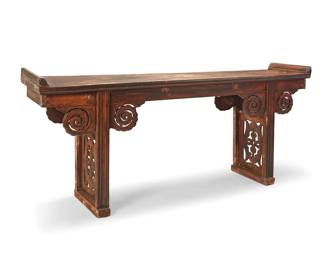 265
An Asian colonial carved wood altar table
18th/19th century
Of notched construction, the tabletop with molding at each end, an openwork cloud-motif apron, and pedestal supports with openwork paneling depicting elaborate ruyi motifs
39.5" H x 91" W x 18.5" D
Estimate: $700 - $900