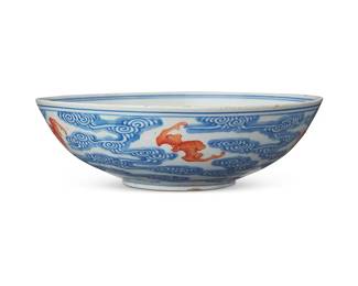 91
A Chinese blue and white and iron red porcelain bowl
Late Qing Dynasty (1644-1912) or later
Bearing a Qinghua Zhenpin mark in blue underglaze
The footed bowl depicting bats in iron red amongst wind/cloud motifs in blue
2.375" H x 7.75" Dia.
Estimate: $2,000 - $4,000
