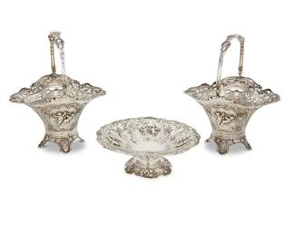2
Three German repoussé silver table articles
Early 20th century
Each basket with .800 and Hanau marks; compote marked: Sterling / 930 / Germany
Each with pierced and repoussé decoration depicting putti and floral motifs, comprising two .800 silver handled baskets with glass liners, and a sterling silver footed compote
3 pieces
Each basket stored: 6.375" H x 8.5" W x 7.5" D; Compote: 3" H x 8.375" Dia.
Total weight: 37.5 oz. troy approximately
Estimate: $800 - $1,200