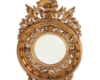 396
A Classical Revival giltwood convex mirror
19th century
The mirror within an elaborately carved frame with acanthus leaves and crested by an eagle
56" H x 31.5" W x 8" D
Estimate: $1,000 - $1,500