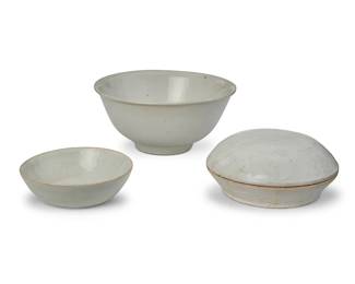 62
Three Chinese white ceramic bowls
Song/Yuan Dynasty (960-1368) or later
Footed bowl bearing a blue underglaze mark
Comprising Qingbai or other white wares including a footed bowl, a smaller bowl, and a lidded bowl with molded foliate motifs
3 pieces
Footed: 2.75" H x 6" Dia.; Smallest:1.25" H x 4" Dia.
Estimate: $500 - $800