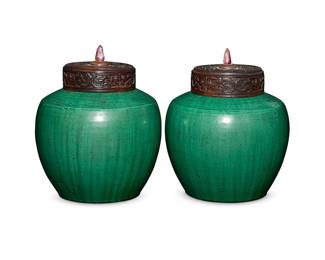68
A pair of Chinese green glazed pottery ginger jars
Kangxi Period (1662-1722) or later
Each with later pierced wood lid mounted with a stone
2 pieces
Each overall: 9.75" H x 8.125" Dia.
Estimate: $4,000 - $6,000
