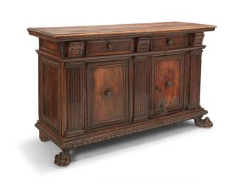 124
An Italian Renaissance walnut credenza
17th century
With architectural cornice and base with egg and dart trim, the front displaying ionic columns in relief, featuring two drawers above two hinged cabinet doors, one locking, revealing a single shelf, raised on front paw feet
41" H x 67.5" W x 22.75" D
Estimate: $3,000 - $5,000