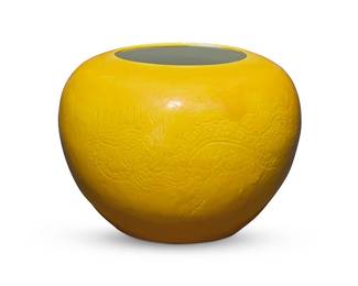 67
A Chinese yellow glazed globular vessel
Qing Dynasty (1644-1912) or later
Bearing apocryphal underglaze reign mark for Chenghua Period (1465-1487)
With incised dragon and flaming pearl motifs
3.75" H x 4.875" Dia.
Estimate: $800 - $1,200