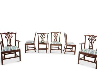 329
A set of twelve George III-style mahogany dining chairs
20th century
Comprising 10 side chairs and 2 armchairs, each with openwork back splat, the armchairs with more carved detailing and scrolled armrest terminals, each with a later fabric-upholstered seat cushion
12 pieces
Each side chair: 37.5" H x 21.75" W x 20.25" D; Each armchair: 40.75" H x 25.75" W x 21.5" D
Estimate: $1,000 - $1,500