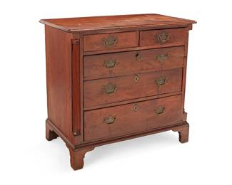346
A Chippendale mixed wood chest of drawers
Late 18th century; likely Pennsylvania
With five locking drawers and later batwing brass pulls, flanked by fluted columnar pilasters, raised on later married bracket feet
34.5" H x 37.25" W x 20.25" D
Estimate: $500 - $700