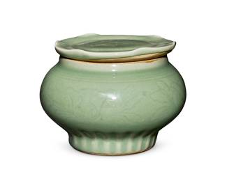 73
A Chinese Longquan celadon lidded jar
Song/Yuan/Ming Dynasty (960-1644) or later
With incised floral motifs
3.875" H x 5.125" Dia.
Estimate: $1,500 - $2,000