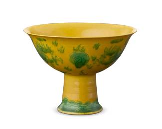66
A Chinese yellow ground porcelain dragon cup
Late Qing Dynasty (1644-1912) or later
Bearing a reign mar for Guangxu Period (1875-1908)
The stemmed cup with green enameled dragon and flaming pearl motifs to exterior and a crane to interior
3.375" H x 4.625" Dia.
Estimate: $1,000 - $1,500