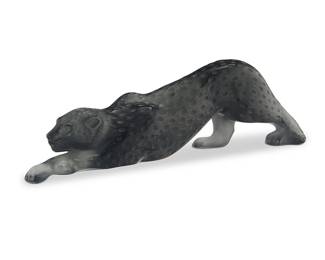 39
A Lalique black glass 'Zeila Panther' figure
Late 20th century
Designed 1989 by Marie-Claude Lalique (1935-2003)
With etched script mark: Lalique ® / France; with applied Lalique factory stickers: Lalique / Made in France / 11671
The frosted molded glass panther figure depicted in a stalking position
4.375" H x 14.75" W x 2.875" D
Estimate: $600 - $800