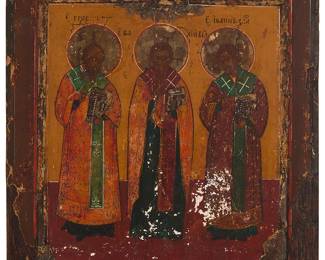119
A Russian Icon, the Three Holy Hierarches
18th century
With paint and gold leaf on a wood panel depicting the three Holy Hierarches, St. Basil the Great, St. Gregory the Theologian, and St. John Chrysostom; with painted inscriptions in Cyrillic above each of the Saints' heads; inscribed in ink, in another hand, on a gallery label affixed verso
11.5" H x 10" W
Estimate: $1,000 - $2,000