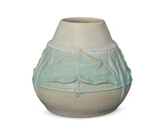49
A Van Briggle pottery vase
Circa 1904; Colorado Springs, CO
Faintly marked for Van Briggle to underside
Model 239, with gradient blue matte glaze and a band of spade leaves in relief
9.25" H x 10.5" Dia.
Estimate: $800 - $1,200